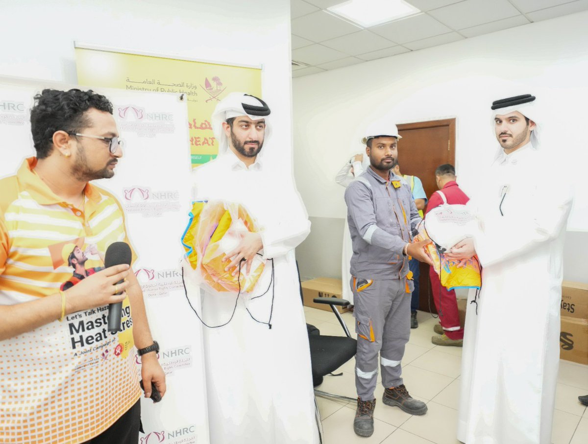 NHRC officials handing over various products to workers as part of the awareness drive.