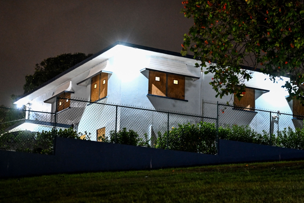 A boarded building is pictured before hurricane Beryl lands in Bridgetown, Barbados on June 29, 2024. (Photo by CHANDAN KHANNA / AFP)
