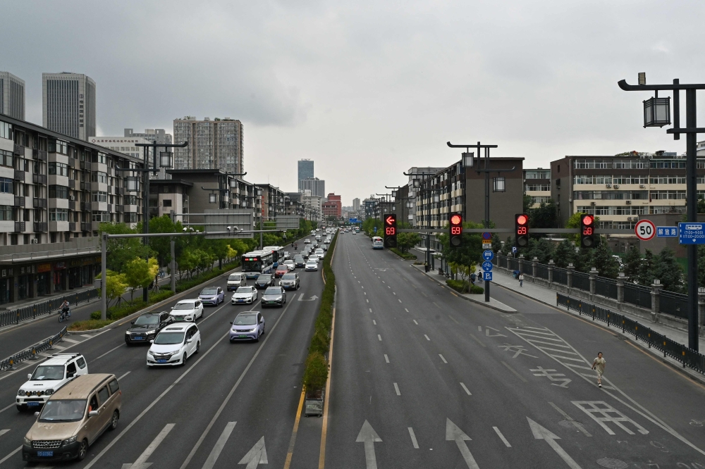 This picture shows a general view of traffic in Taiyuan, in China's northern Shanxi province on July 2, 2024. (Photo by Adek Berry / AFP)