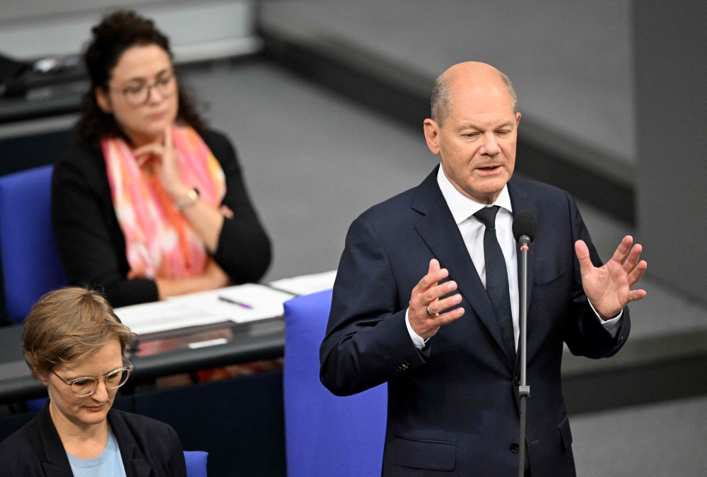 German Chancellor Olaf Scholz speaks during a question time on July 3, 2024 at the Bundestag (lower house of parliament) in Berlin. (Photo by RALF HIRSCHBERGER / AFP)
