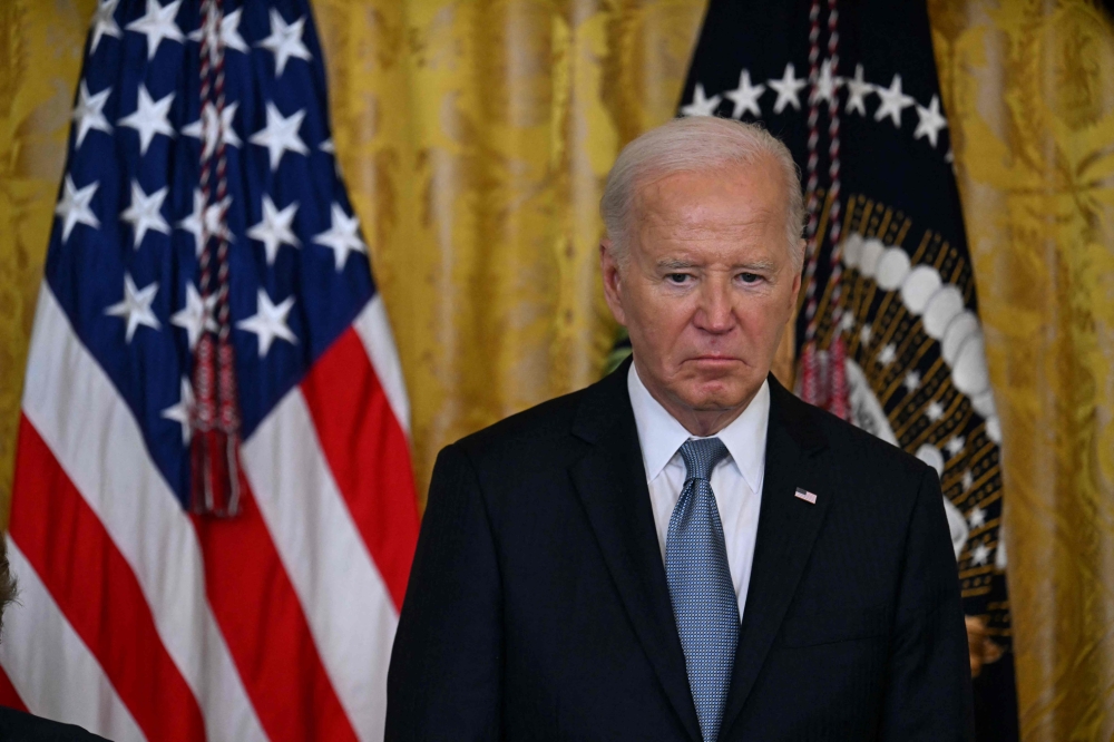 US President Joe Biden looks on during a Medal of Honor ceremony in the East Room of the White House in Washington, DC, on July 3, 2024. (Photo by Jim Watson / AFP)