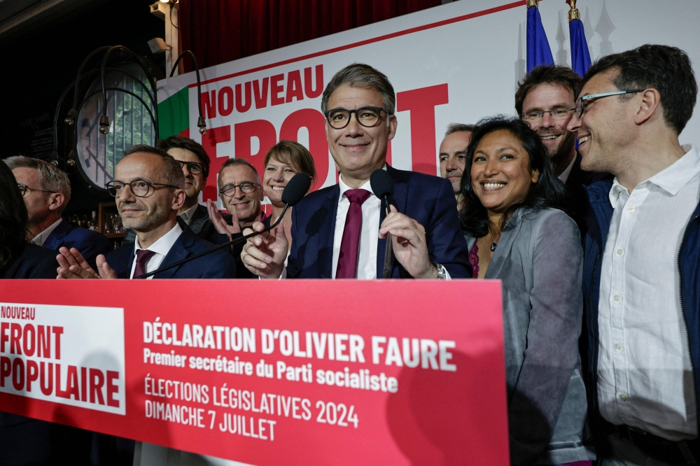 First Secretary of the French left-wing Socialist Party (PS) Olivier Faure (CR) prepares to deliver a speech on July 7, 2024. (Photo by Stephane De Sakutin / AFP)