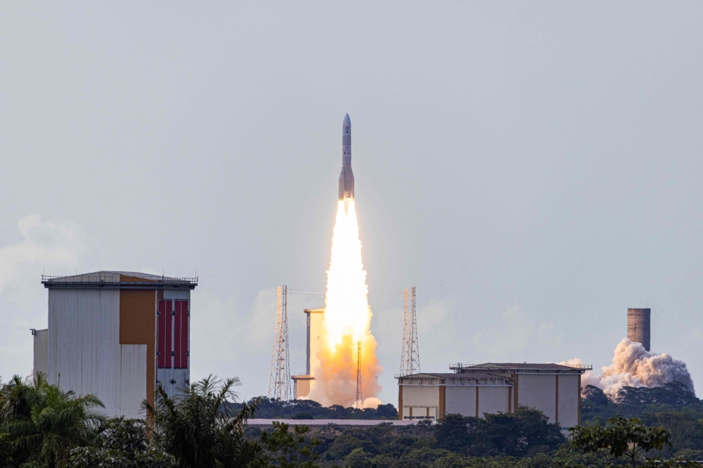This photograph shows the take-off of the European Space Agency (ESA) satellite launcher Ariane 6 rocket from its launch pad, at the Guiana Space Centre in Kourou, French Guiana, on July 9, 2024. (Photo by Jody Amiet / AFP)