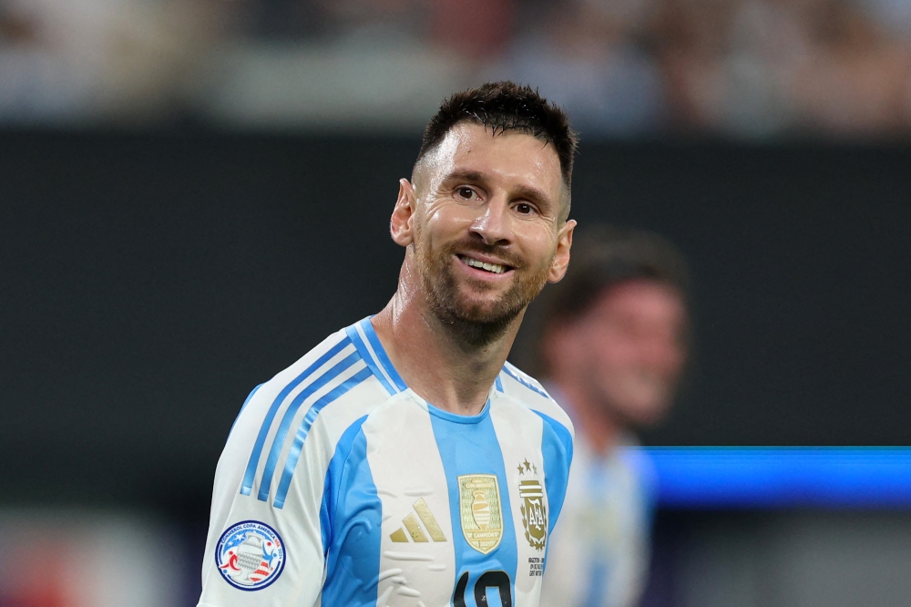 Lionel Messi of Argentina smiles during the CONMEBOL Copa America 2024 semifinal match at MetLife Stadium on July 09, 2024. Elsa/Getty Images/AFP 