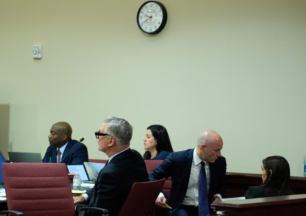 US actor Alec Baldwin (2L) attends his trial on involuntary manslaughter at Santa Fe County District Court in Santa Fe, New Mexico, on July 12, 2024. (Photo by RAMSAY DE GIVE / POOL / AFP)
