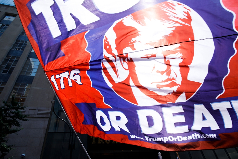 Supporters of former US president Donald Trump gather outside Trump Tower in New York on July 14, 2024, one day after Trump survived an apparent assassination attempt at a rally in Pennsylvania. (Photo by Kena Betancur / AFP)