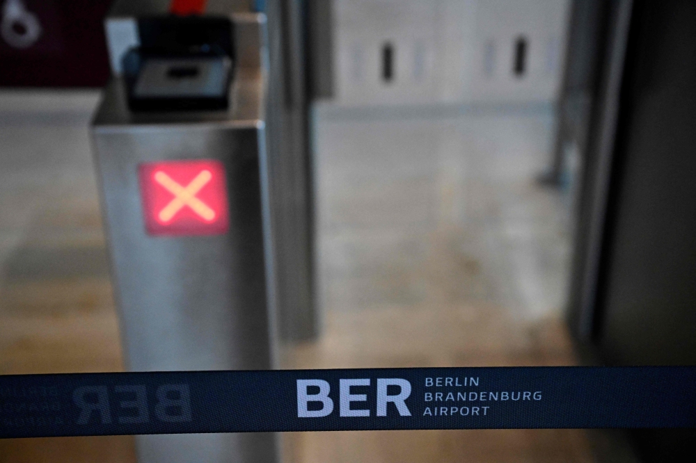  A closed gate entry is pictured at the Berlin Brandenburg airport (BER) in Schoenefeld on February 1, 2024. Photo by Tobias SCHWARZ / AFP