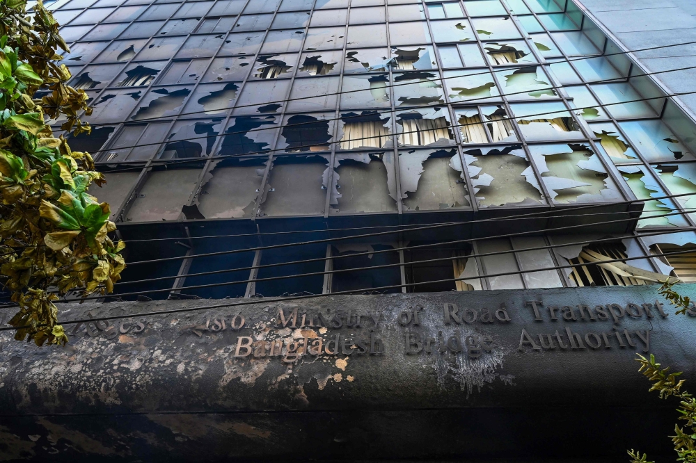 Burnt building of Bangladesh bridge authority is pictured after students set it on fire amid the ongoing anti-quota protest in Dhaka on July 19, 2024. (Photo by Munir UZ ZAMAN / AFP)
