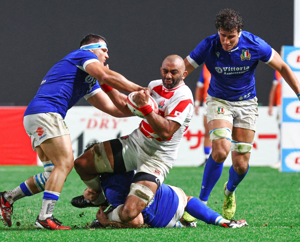 Japan's Michael Leitch (C) is challenged during the international rugby test match between Japan and Italy at Sapporo Dome in Hokkaido on July 21, 2024. (Photo by JIJI PRESS / AFP) / Japan OUT
