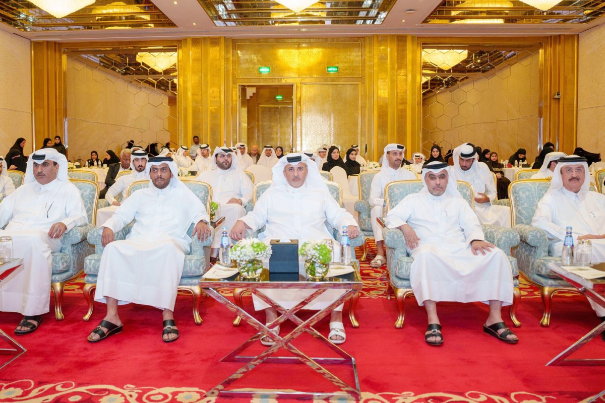 Minister of Environment and Climate Change H E Dr. Abdullah bin Abdulaziz bin Turki Al Subaie (centre) and other officials attending an honouring ceremony for participants of the first edition of the 2024 Summer Environmental Club programme yesterday.  
