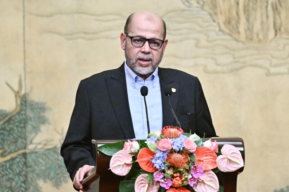 Mussa Abu Marzuk, senior member of the Palestinian Islamist movement Hamas, speaks during an event hosted by China's Foreign Minister Wang Yi (not pictured) at the Diaoyutai State Guesthouse in Beijing on July 23, 2024. (Photo by Pedro Pardo / AFP)
 