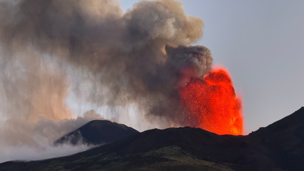 (FILES) This general view shows an eruption of the Mount Etna volcano in Sicily on July 5, 2024. The airport at Catania in Sicily, a top Italian tourist destination has on July 23, 2024, suspended all flights as ash from an eruption at nearby Mount Etna entered the airspace. (Photo by Giuseppe Distefano / Etna Walk / AFP)
