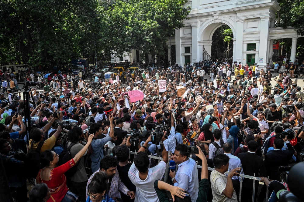 People take part in a protest march outside the High Court building demanding justice for the victims arrested and killed in the recent countrywide violence in Dhaka on July 31, 2024. (Photo by Munir Uz Zaman / AFP)
 