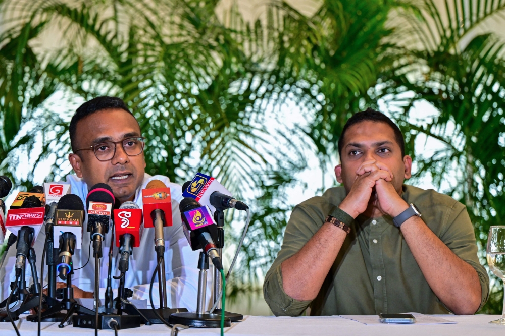 Sri Lanka's tourism minister Harin Fernando and labour minister Manusha Nanayakkara (L) attend a press conference in Colombo on August 9, 2024, shortly after they were sacked over defection. (Photo by Ishara S. KODIKARA / AFP)
