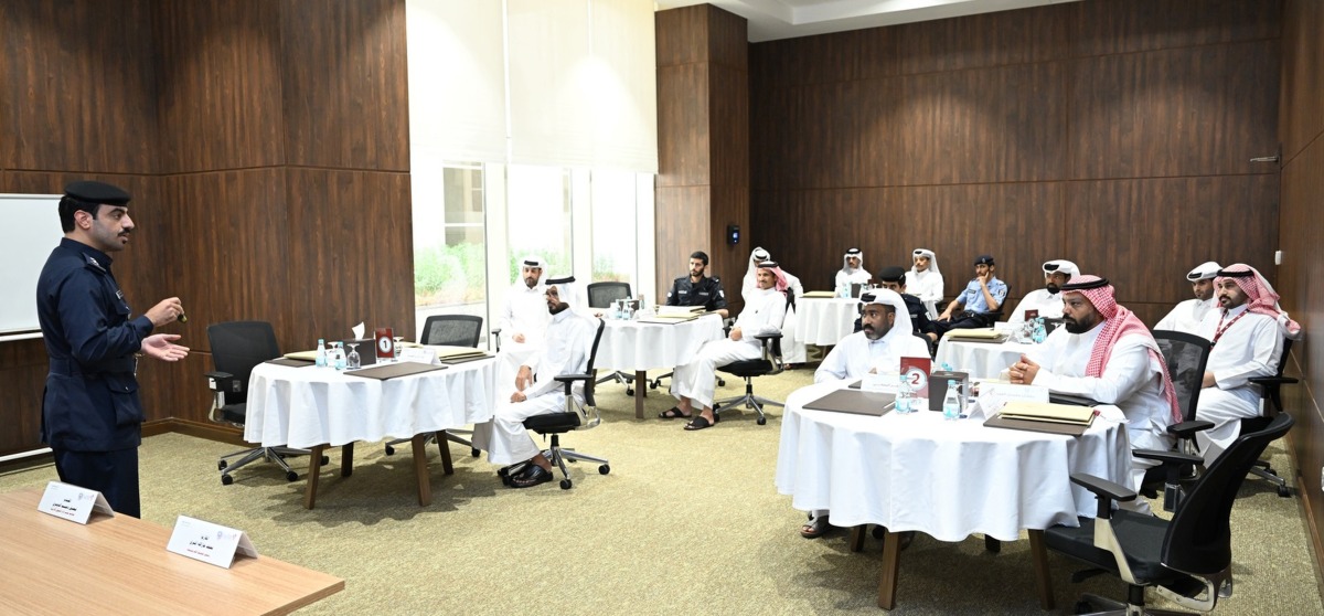 Officials with participants during the course.