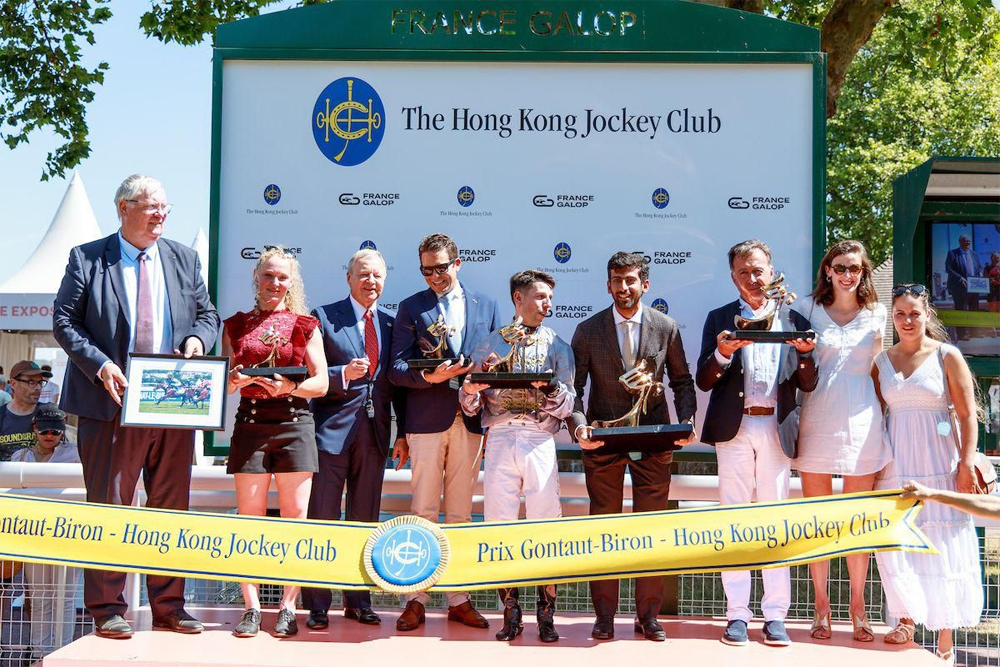 The connections of Al Hakeem pose after receiving their awards. 