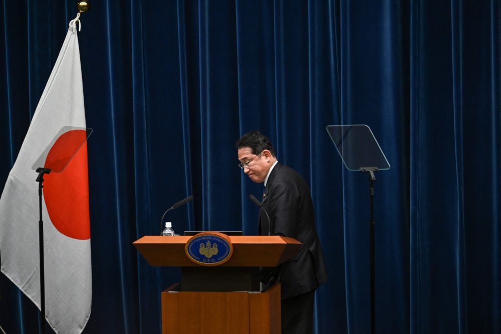 Japan's Prime Minister Fumio Kishida prepares to leave at the end of a press conference at the prime minister's office in Tokyo on August 14, 2024. (Photo by Philip FONG / POOL / AFP)
