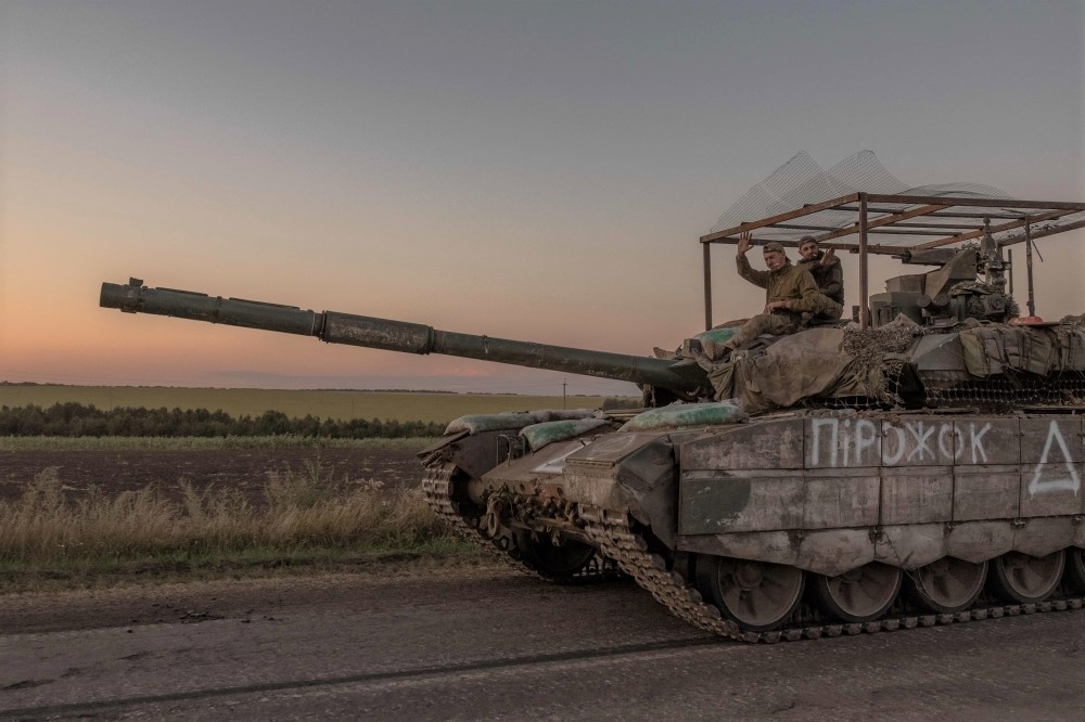 Ukrainian servicemen operate a tank on a road near the border with Russia, in the Sumy region of Ukraine, on August 14, 2024. (Photo by Roman Pilipey / AFP)

