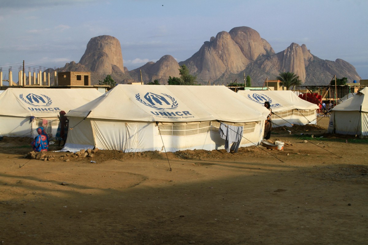 People already displaced by conflict, rest by tents at a makeshift campsite they were evacuated to following deadly floods in the eastern city of Kassala on August 11, 2024. Every year in Sudan, sasonal peak flow on the Nile is accompanied by torrential rains, destroying homes, wrecking infrastructure and claiming lives. But the impact is expected to be worse this year after nearly 16 months of fighting between the army and the paramilitary Rapid Support Forces (RSF) that has pushed millions of displaced people into flood zones. (Photo by AFP)