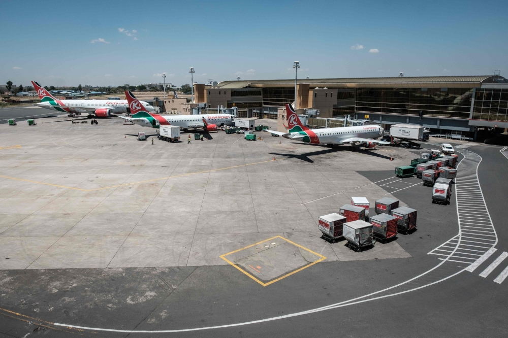 Aircrafts belonging to Kenya Airways are statione at the departure terminal during a strike by the airline workers at the Jomo Kenyatta International Airport in Nairobi on March 6, 2019. AFP / Yasuyoshi CHIBA

