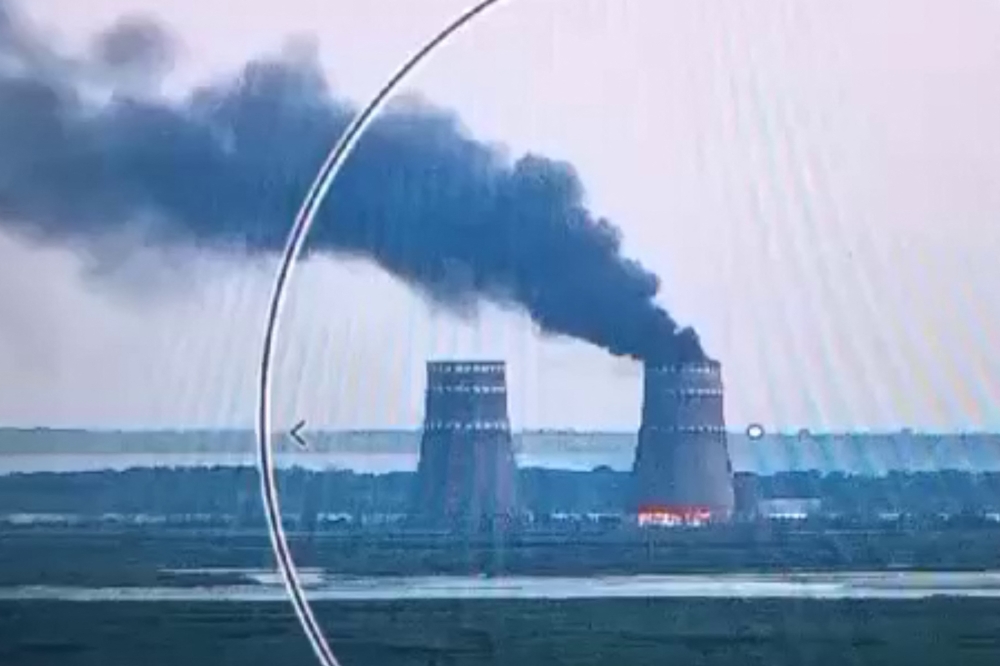 This video grab taken from a handout footage released by the Ukrainian Presidential Press Service on August 11, 2024, shows a fire at a cooling tower of the Russian-controlled Zaporizhzhia nuclear power plant in Energodar, Southern Ukraine. (Photo by Handout / UKRAINIAN PRESIDENTIAL PRESS SERVICE / AFP)

