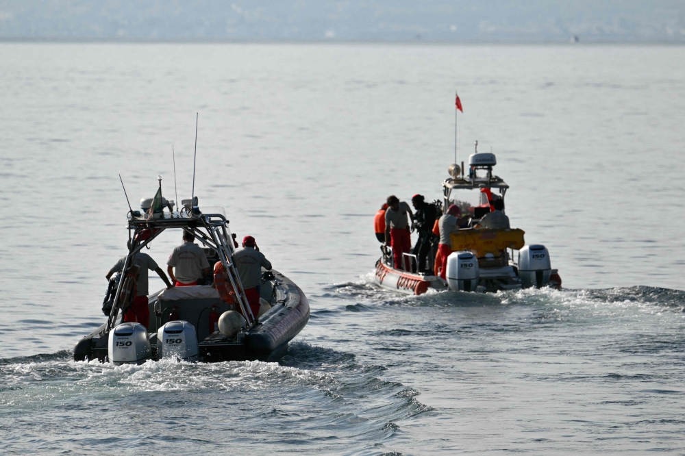 Divers of the Vigili del Fuoco, the Italian Corps. of Firefighters leave Porticello harbor near Palermo, to resume research for a last missing person on August 23, 2024, four days after the British-flagged luxury yacht Bayesian sank. (Photo by Alberto PIZZOLI / AFP)
