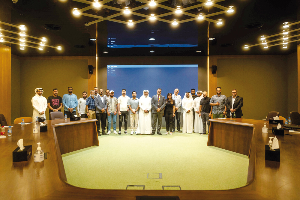Officials from QC, Young Entrepreneurs Club and Qatar Post along other attendees during the workshop.