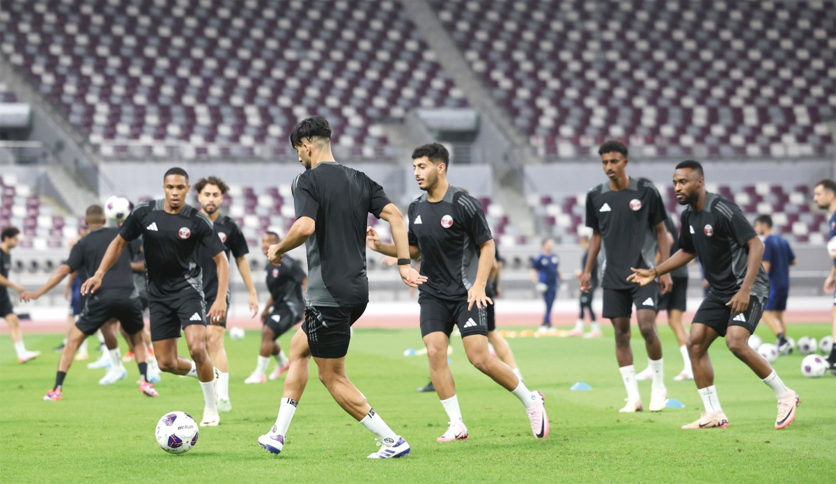 Qatar players attend a training session at Khalifa International Stadium yesterday. 