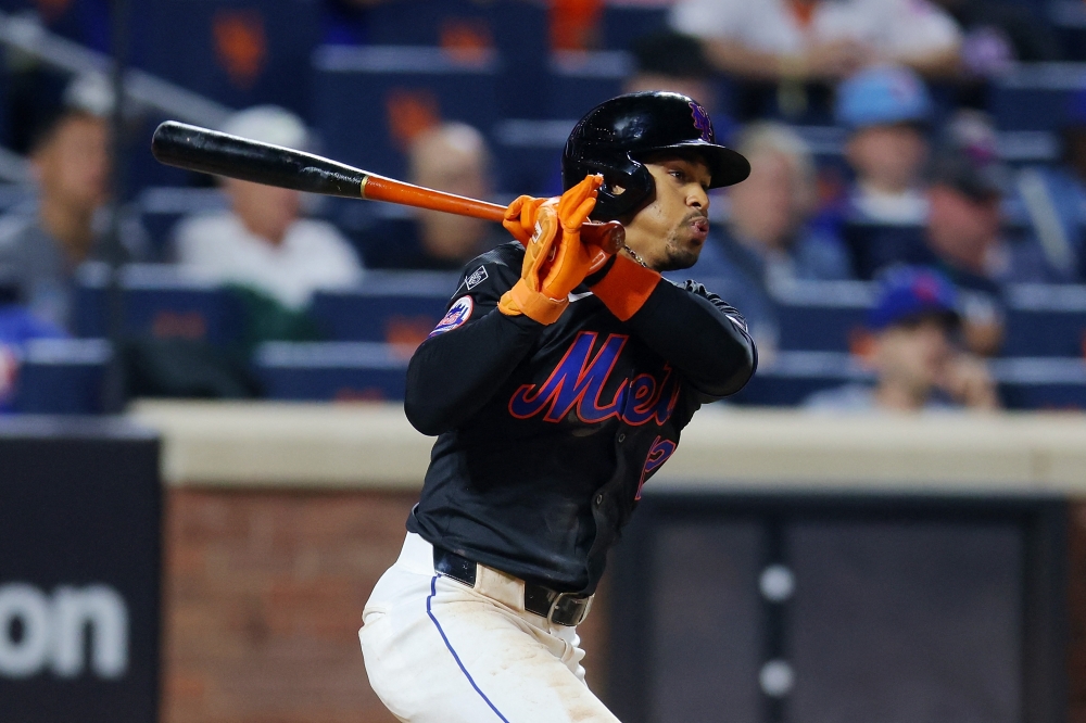 Francisco Lindor #12 of the New York Mets hits an RBI single in the fourth inning against the Boston Red Sox at Citi Field on September 02, 2024 in New York City. (Photo by Mike Stobe / GETTY IMAGES NORTH AMERICA / Getty Images via AFP)