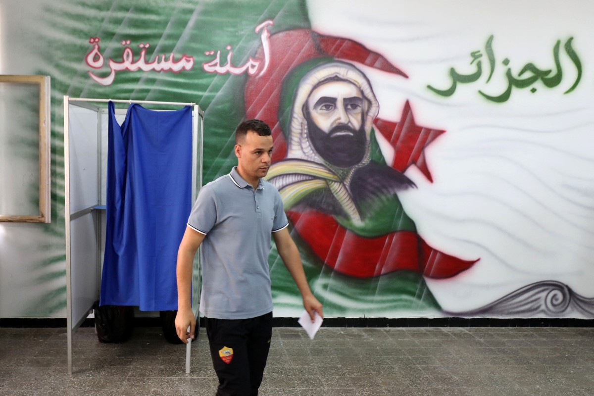 An Algerian man votes at a polling station during the presidential election, in Algiers on September 7, 2024. Photo by AFP.
