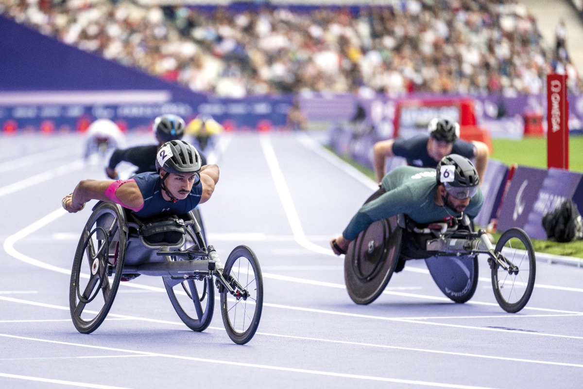 Qatari para athlete Ali Arshad (left) competes in the men's 800 meters wheelchair (T34 category) final at the Paris 2024 Paralympic Games yesterday.