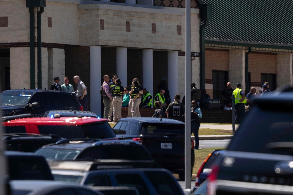 Law enforcement and first responders respond to Apalachee High School in Winder, Georgia, on September 4, 2024. (Photo by Christian Monterrosa / AFP)

