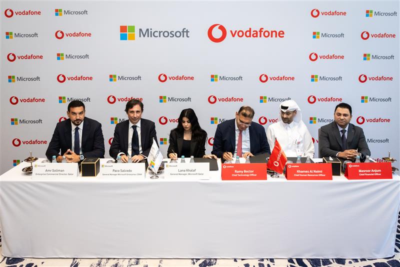 Officials from Vodafone Qatar and Microsoft during agreement signing ceremony.