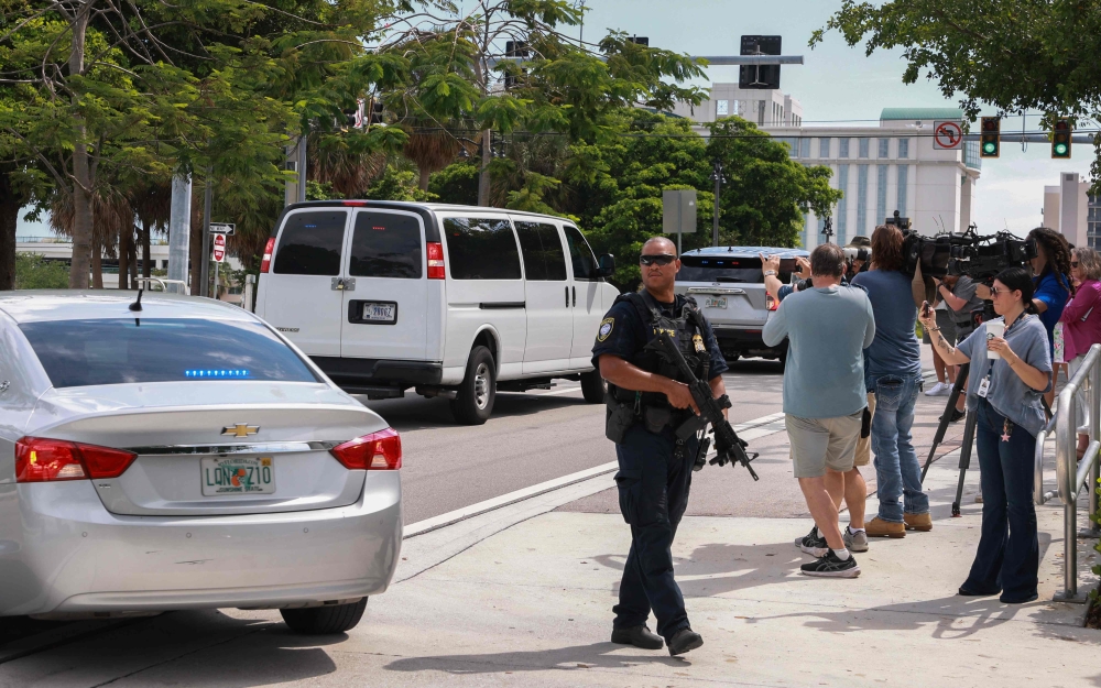 A van carrying Ryan Wesley Routh, the suspect in the apparent assassination attempt on former President Donald Trump, is driven from the federal courthouse after he attended an initial appearance on September 16, 2024, in West Palm Beach, Florida. (Photo by Joe Raedle/Getty Images via AFP)
