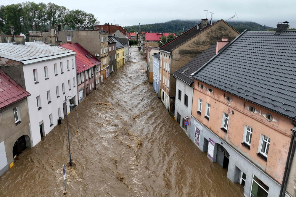This aerial photograph taken on September 15, 2024 shows a view of the flooded streets in Glucholazy, southern Poland. Photo by Sergei GAPON / AFP
