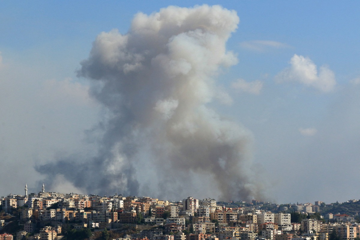 Smoke billows from a site targeted by Israeli shelling in the southern Lebanese village of Zaita on September 23, 2024.(Photo by Mahmoud ZAYYAT / AFP)