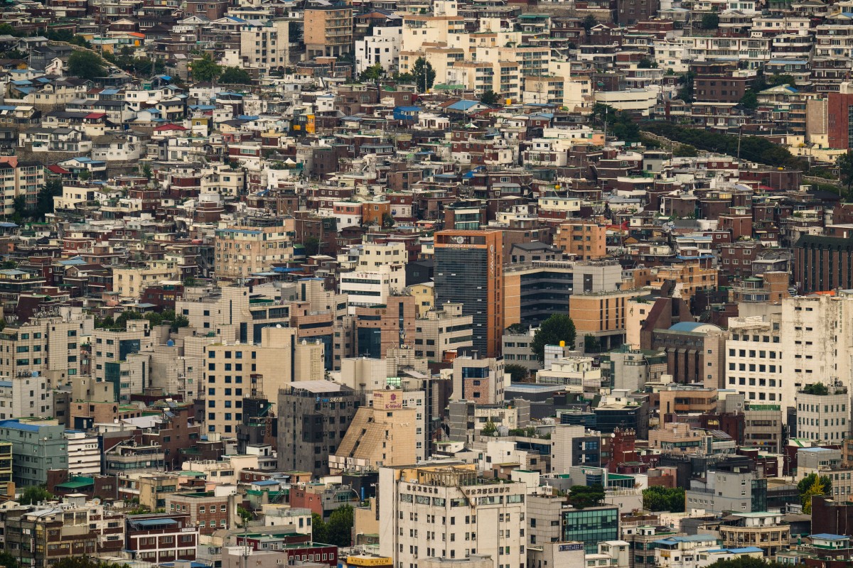 A general view taken below the Namsan Tower shows commercial and residential buildings in Seoul on September 25, 2024. (Photo by ANTHONY WALLACE / AFP)