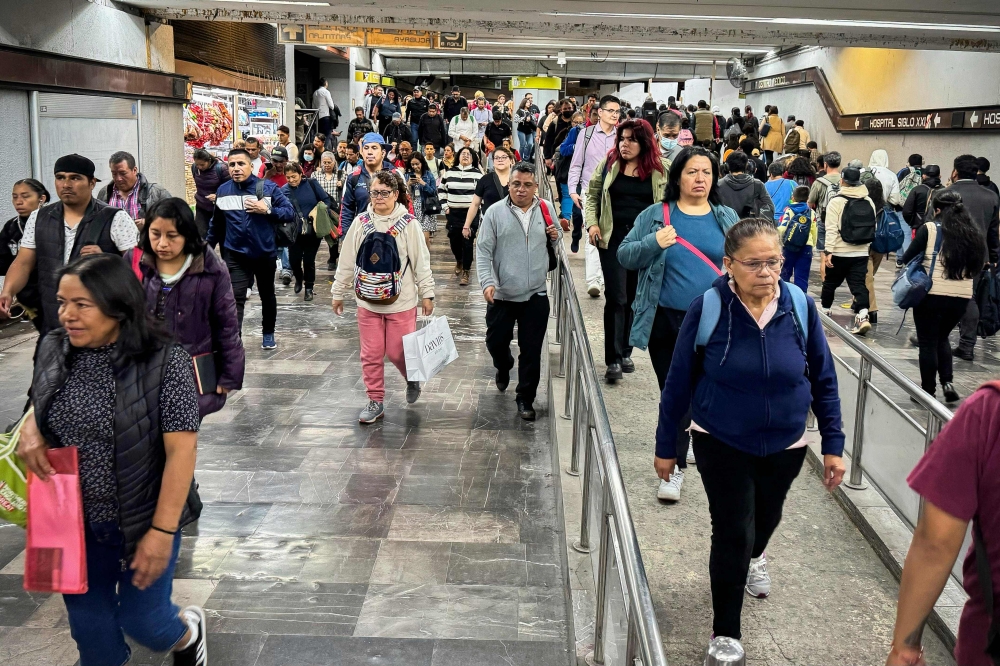 Commuters travel through the Centro Medico metro station in Mexico City, Mexico, on September 25, 2024. Photo by Rodrigo Oropeza / AFP
