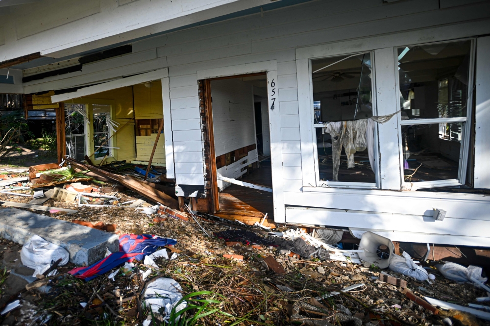 A house destroyed by Hurricane Helene after making landfall is seen in Cedar Key, Florida, on September 27, 2024.  (Photo by Miguel J. Rodriguez Carrillo / AFP)

