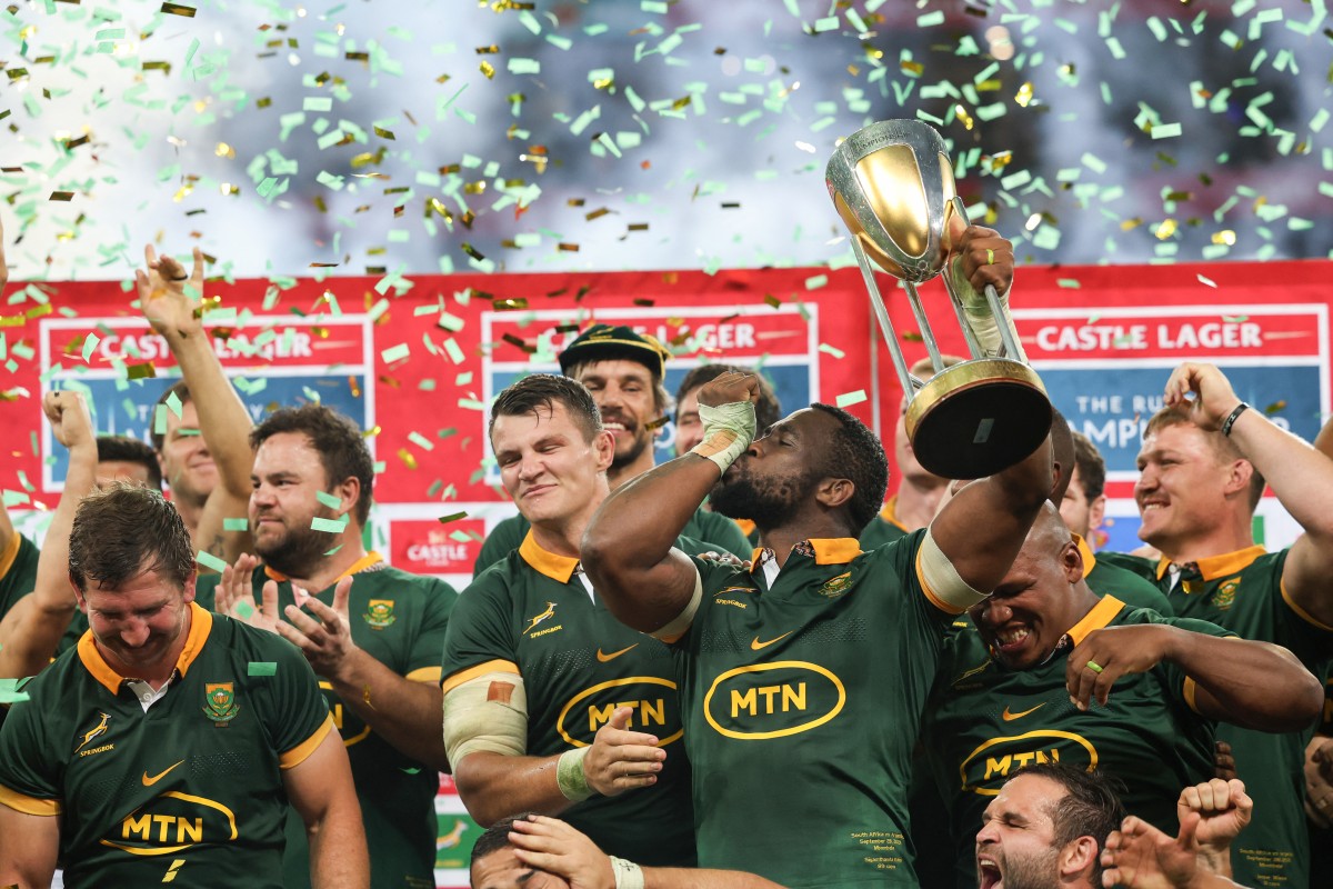 South Africa's flanker Siya Kolisi (C) lifts the trophy while kissing his wrist as he celebrates with his teammates after they won the Rugby Championship following their match between South Africa and Argentina at Mbombela Stadium in Mbombela on September 28, 2024. (Photo by PHILL MAGAKOE / AFP)