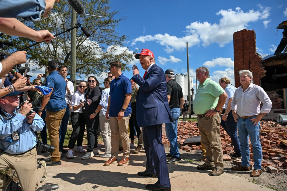 Former US President and Republican presidential candidate Donald Trump delivers remarks to the press in the aftermath of powerful storm Helene at Chez What furniture store in Valdosta, Georgia, September 30, 2024. (Photo by Chandan Khanna / AFP)