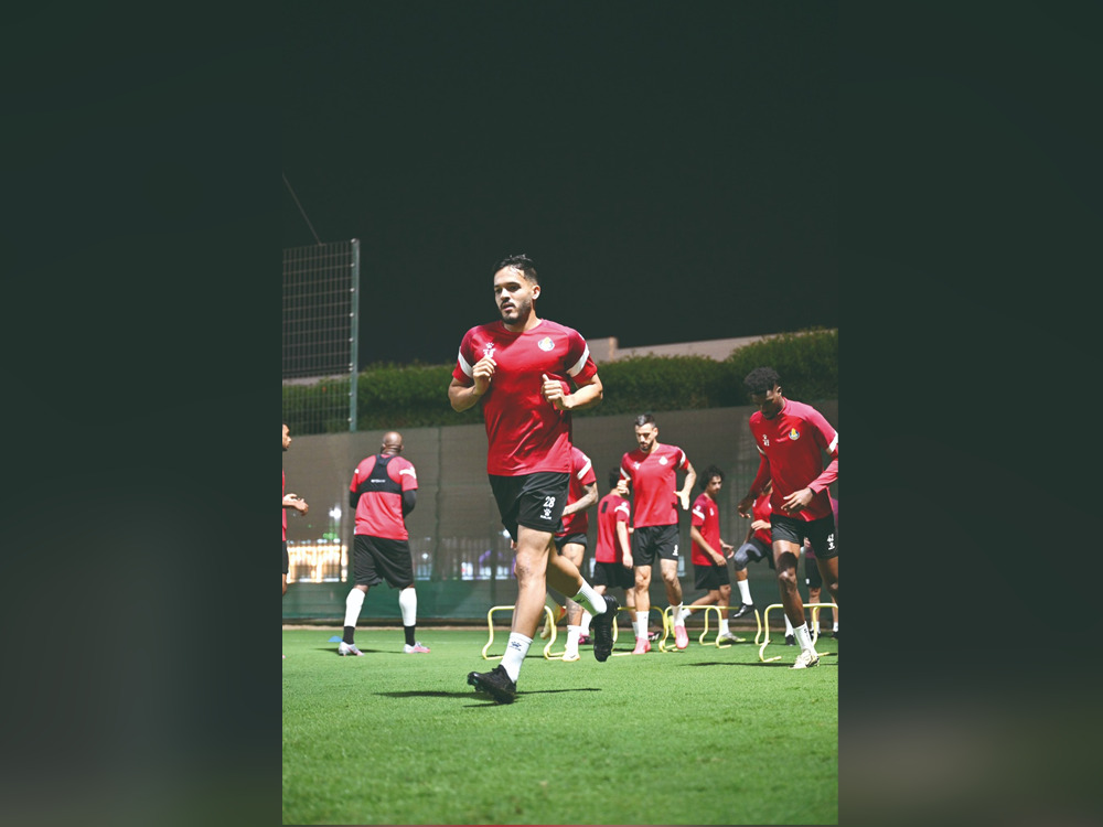 Al Gharafa's Wajdi Kechrida trains with teammates.