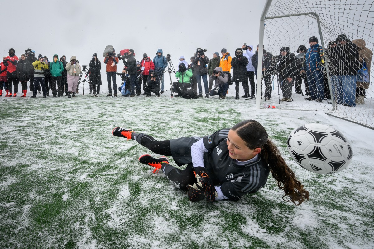 Photo used for demonstration purposes. Team Europe Ambassador goalkeeper Madlaina Riesch tries to deflect a ball on a fooball pitch set at 3,454m above sea level in Aletsch glacier in the Swiss Alps, during an event launching the ticket sales for UEFA Women’s EURO 2025 football tournament, at the Jungfraujoch, on October 1, 2024. Photo by Fabrice COFFRINI / AFP.
