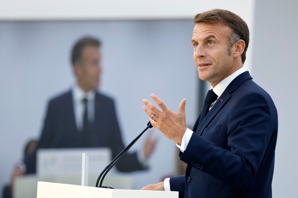France's President Emmanuel Macron delivers a speech during the closing session of the 19th Summit of the Francophonie at the Grand Palais in Paris, on October 5, 2024. (Photo by Ludovic MARIN / POOL / AFP)
