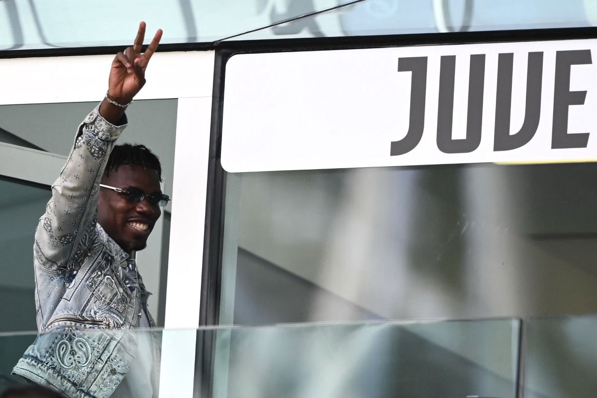 French forward Paul Pogba waves as he arrives to attend the Italian Serie A football match between Juventus and Cagliari at the Allianz stadium in Turin, on October 6, 2024. (Photo by MARCO BERTORELLO / AFP)
