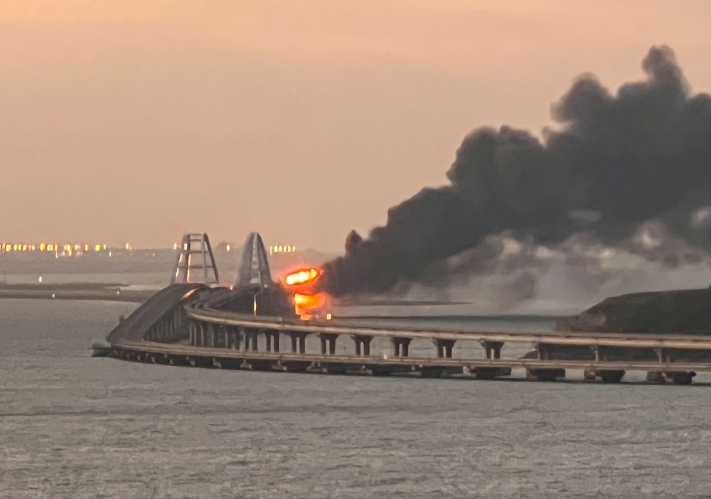 A view shows a fire on the Kerch bridge at sunrise in the Kerch Strait, Crimea, October 8, 2022. File photo for representation purposes only. Reuters/Stringer

