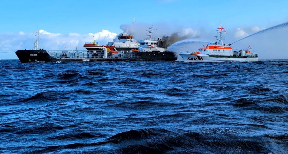 This handout photo taken and released on October 11, 2024 by the DGzRS (Deutsche Gesellschaft zur Rettung Schiffbruechiger = German Maritime Search and Rescue Service) shows smoke billowing from the German-flagged tanker ship 