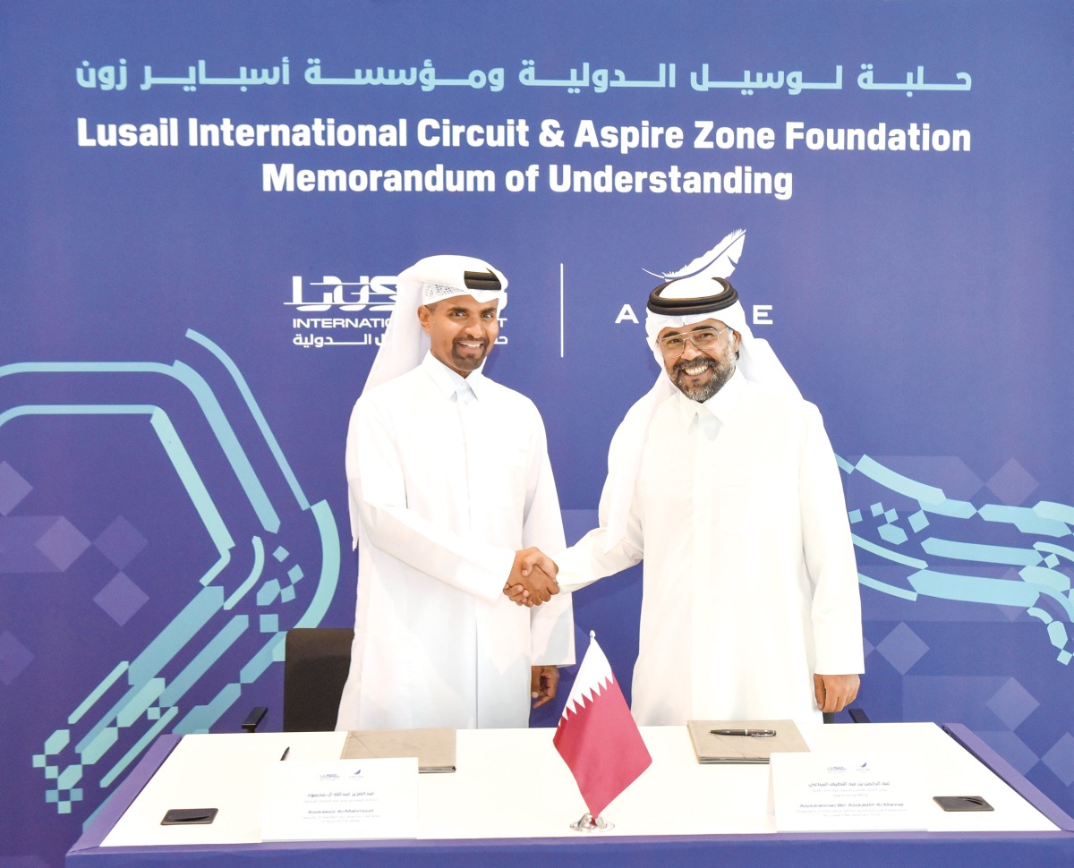 Qatar Motor & Motorcycle Federation (QMMF) and LIC President Abdulrahman bin Abdullatif Al Mannai and Deputy President and Director General of Sports Facilities Management at Aspire Zone Foundation Abdulaziz Abdullah Al Mahmoud shake hands during the MoU signing ceremony.