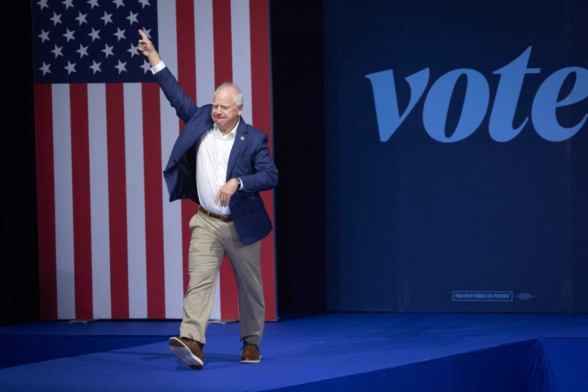 Democratic vice presidential nominee, Minnesota Gov. Tim Walz is introduced at a get-out-the-vote rally on October 22, 2024 in Madison, Wisconsin. (Photo by SCOTT OLSON / GETTY IMAGES NORTH AMERICA / Getty Images via AFP)
