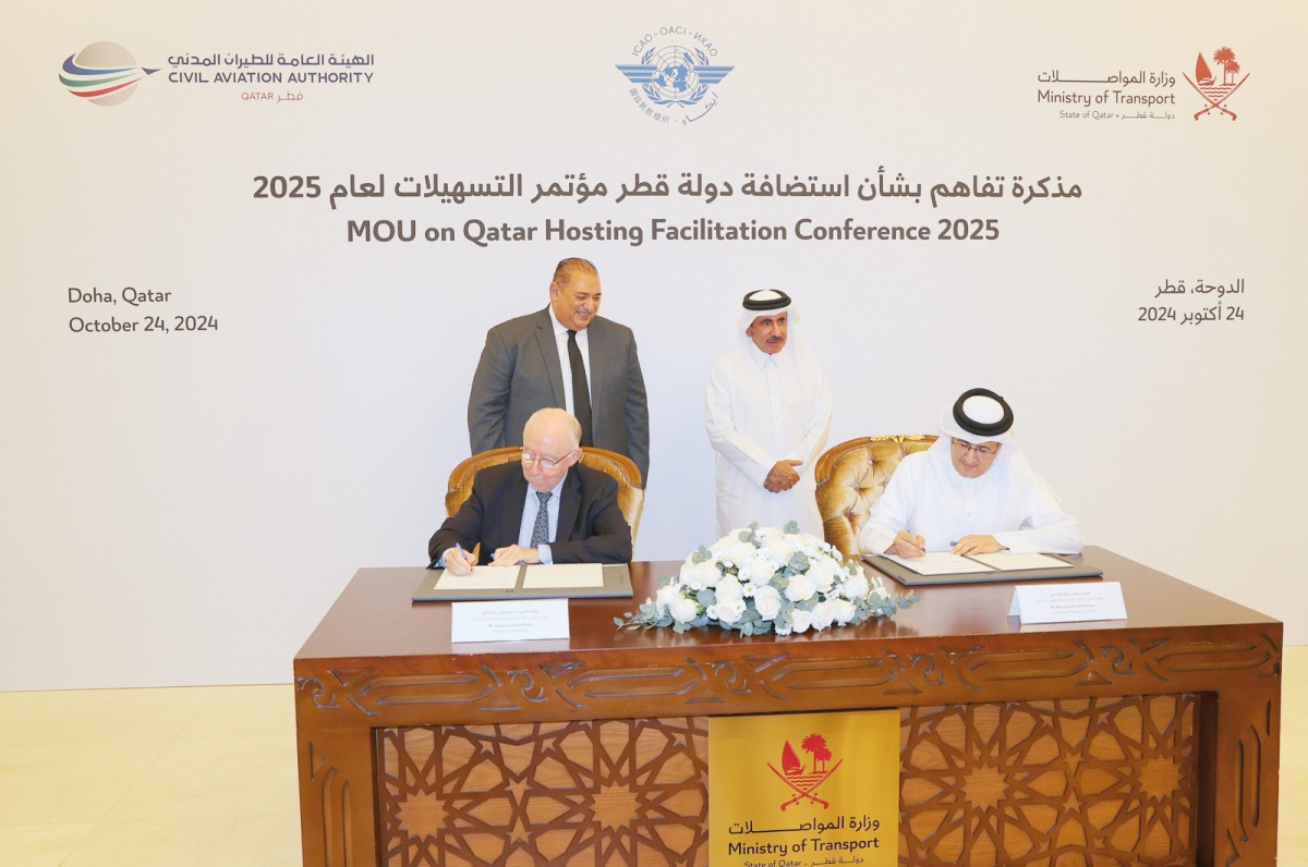 Minister of Transport H E Jassim Saif Ahmed Al Sulaiti (right, standing) witnessing the signing of the MoU by In-charge of Managing QCAA Mohammed Faleh Al Hajri (right, seated) and President of the ICAO Council H E Salvatore Sciacchitano (left, seated) in Doha yesterday.